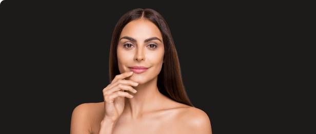 Woman smiling after aesthetic enhancement treatment at Be You Esthetic Suites.